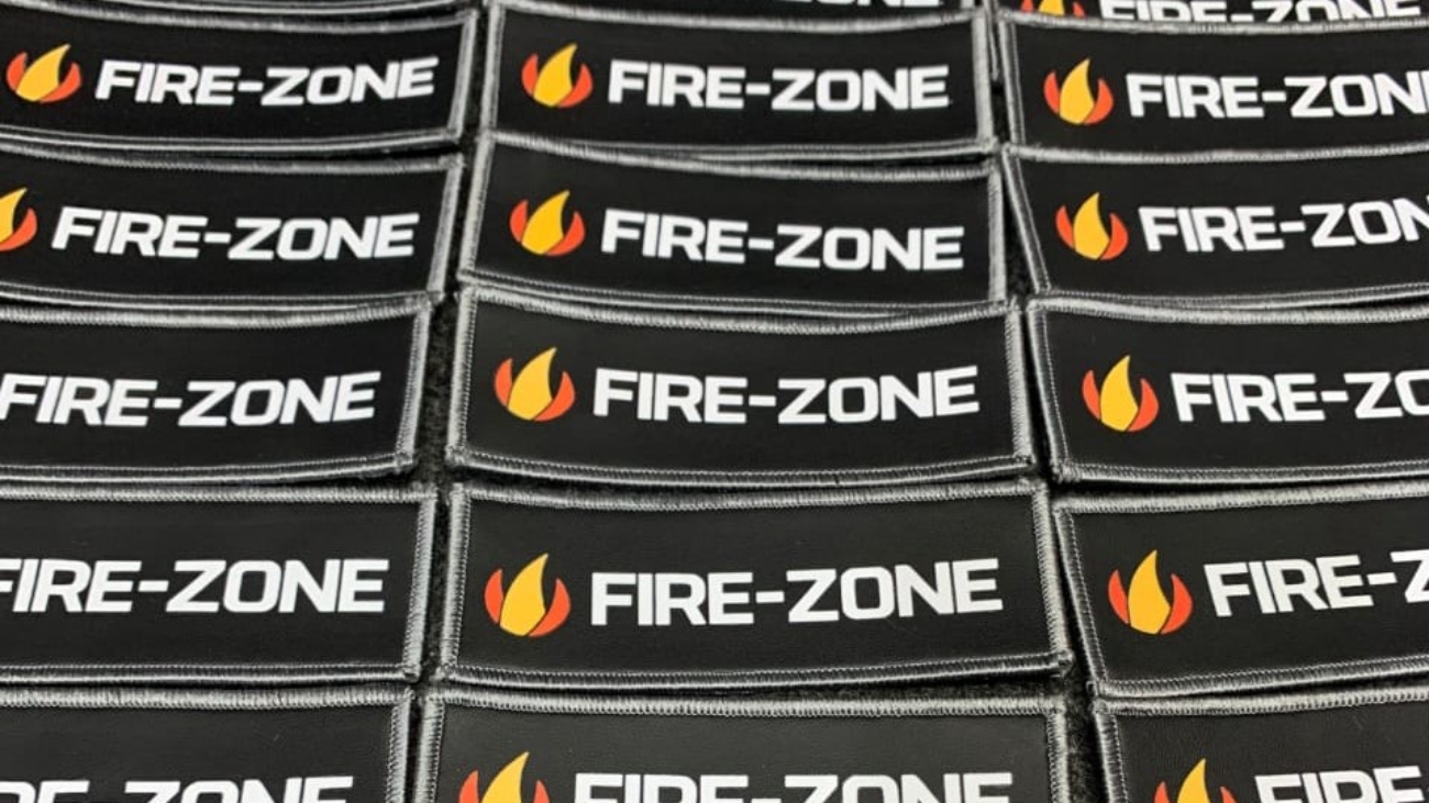Rectangular patches with a black background displaying the text 'FIRE-ZONE