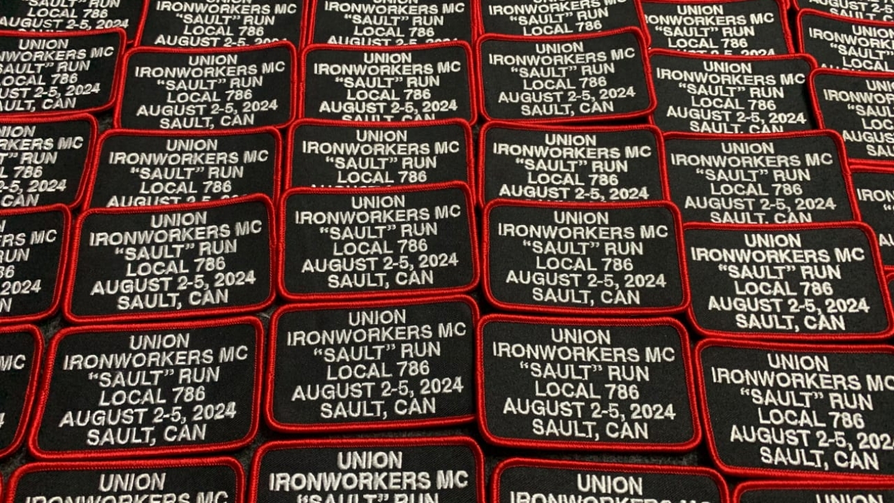 Multiple rectangular patches with black backgrounds, red borders, and white text