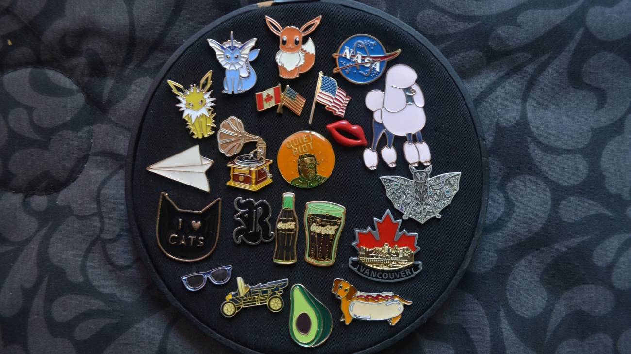 Assorted PVC patches arranged on a circular black background